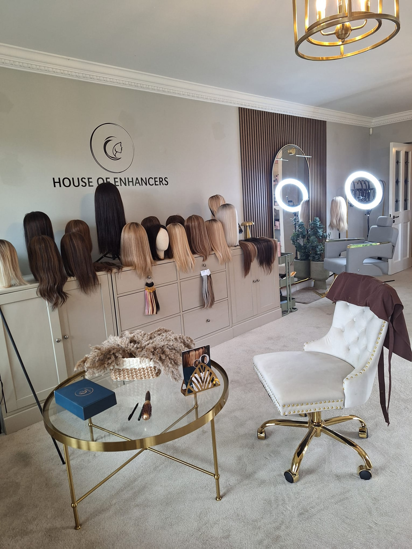 Inside the House of Enhancers studio in Kilmacanogue, with hair pieces on display, mirrors and a single styling chair